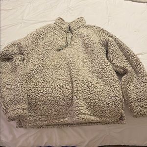 Jeans, fleece jacket & vest, and bag.